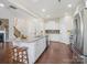 Bright, open kitchen featuring a large island, stainless steel appliances, and hardwood floors at 79411 Ridgehaven Rd, Indian Land, SC 29720