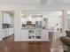 Bright kitchen with white cabinetry, granite countertops, and open shelving at 79411 Ridgehaven Rd, Indian Land, SC 29720