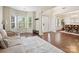 Open-concept space with hardwood floors, a cozy couch, and a dining area at 79411 Ridgehaven Rd, Indian Land, SC 29720
