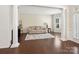 Bright living room featuring hardwood floors, neutral walls, and decorative columns at 79411 Ridgehaven Rd, Indian Land, SC 29720