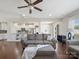 Open-concept living room and kitchen with hardwood floors and modern decor at 79411 Ridgehaven Rd, Indian Land, SC 29720