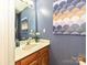 Charming half bath with stylish wallpaper and sink at 9305 Four Mile Creek Rd, Charlotte, NC 28277