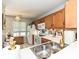 Well-lit kitchen featuring updated appliances and ample cabinet space at 9305 Four Mile Creek Rd, Charlotte, NC 28277