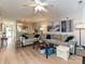 Open-concept living room featuring hardwood floors, stylish seating, and modern decor at 9305 Four Mile Creek Rd, Charlotte, NC 28277