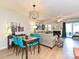 Bright living room with modern lighting, fireplace, and sliding door to outdoor area at 9305 Four Mile Creek Rd, Charlotte, NC 28277