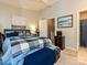 Comfortable main bedroom featuring a wooden bed frame and art at 9305 Four Mile Creek Rd, Charlotte, NC 28277