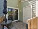 Cozy outdoor patio with seating, umbrella, and sliding glass door access at 9305 Four Mile Creek Rd, Charlotte, NC 28277