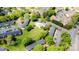 Aerial view of the complex featuring mature trees and a refreshing community pool at 10967 Harrowfield Rd, Charlotte, NC 28226