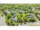 Aerial view of the complex showing lush landscaping, mature trees, parking, and highway at 10967 Harrowfield Rd, Charlotte, NC 28226