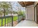 The back porch overlooks the lawn and mature landscaping at 10967 Harrowfield Rd, Charlotte, NC 28226