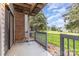 The back porch overlooks the lawn and mature landscaping at 10967 Harrowfield Rd, Charlotte, NC 28226