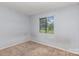 Spacious bedroom featuring a window to let in natural light at 10967 Harrowfield Rd, Charlotte, NC 28226