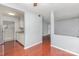 Open-concept living area with hardwood floors seamlessly connecting to the kitchen space at 10967 Harrowfield Rd, Charlotte, NC 28226