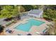 Community pool area offering a refreshing escape with lounge seating and shaded trellis at 10967 Harrowfield Rd, Charlotte, NC 28226