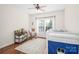 Bright bedroom with a rocking chair, toy storage shelf and wood flooring at 1103 Hillcrest Ridge Dr, Salisbury, NC 28146