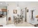 Bright breakfast nook features a glass table set, pendant lighting, and natural light from the door and windows at 1103 Hillcrest Ridge Dr, Salisbury, NC 28146
