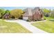 Lovely brick home features an attached garage, mature trees and well-maintained lawn at 1103 Hillcrest Ridge Dr, Salisbury, NC 28146