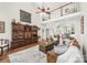 Open living room with high ceilings, a fireplace, and an eye-catching display cabinet at 1103 Hillcrest Ridge Dr, Salisbury, NC 28146