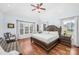 Bright main bedroom with a ceiling fan, a large window and a comfortable looking chair at 1103 Hillcrest Ridge Dr, Salisbury, NC 28146