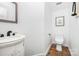 Bright powder room with tile floor, updated fixtures and neutral colors at 1103 Hillcrest Ridge Dr, Salisbury, NC 28146