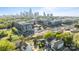Aerial view of a residential neighborhood with city skyline in the background at 1121 N Alexander St, Charlotte, NC 28206