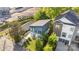 Aerial view of contemporary blue home featuring modern design, landscaping, and a driveway at 1121 N Alexander St, Charlotte, NC 28206