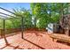 Large wooden back deck with outdoor structure and storage shed surrounded by mature trees at 1121 N Alexander St, Charlotte, NC 28206