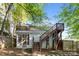 Backyard featuring a screened porch and elevated deck at 1121 N Alexander St, Charlotte, NC 28206