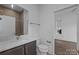Modern bathroom featuring a vanity with white countertop, tiled shower, and updated fixtures at 1121 N Alexander St, Charlotte, NC 28206