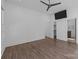 Spacious bedroom features hardwood floors, ceiling fan, and ensuite bath and walk-in closet at 1121 N Alexander St, Charlotte, NC 28206