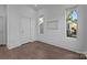 Bright bedroom featuring hardwood floors, three windows, and closet at 1121 N Alexander St, Charlotte, NC 28206