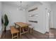 Contemporary dining room with stylish lighting and a spacious table for gatherings at 1121 N Alexander St, Charlotte, NC 28206