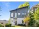 Contemporary two-story home featuring gray siding, modern windows, and well-maintained landscaping at 1121 N Alexander St, Charlotte, NC 28206