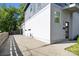 Contemporary home featuring mixed material exterior, modern front door, and concrete driveway at 1121 N Alexander St, Charlotte, NC 28206