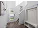 Bright foyer with stairs, bench, and mirrored decor create a welcoming entrance at 1121 N Alexander St, Charlotte, NC 28206