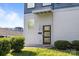 A modern front door is accented by green bushes at 1121 N Alexander St, Charlotte, NC 28206