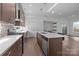 Well-designed kitchen featuring stainless steel appliances, island with seating, and open layout at 1121 N Alexander St, Charlotte, NC 28206