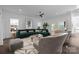 Inviting living room with large windows, comfortable seating, and decorative accents at 1121 N Alexander St, Charlotte, NC 28206