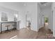 Bright living room features hardwood floors, multiple windows, and a bar-height table with seating for entertaining at 1121 N Alexander St, Charlotte, NC 28206