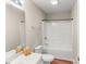 Well-lit bathroom featuring a shower-tub combination and modern fixtures, offering a clean and functional space at 115 Keswick Ln, Mooresville, NC 28117