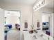 Bright bathroom with double sinks and views into the bedroom, creating an open and airy feel at 115 Keswick Ln, Mooresville, NC 28117