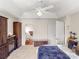 This bedroom is spacious, with a large bed, ceiling fan, and ample storage for comfort and style at 115 Keswick Ln, Mooresville, NC 28117