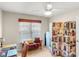 Functional home office with a ceiling fan, desk, chair, and unique decor for a productive workspace at 115 Keswick Ln, Mooresville, NC 28117