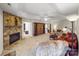 Cozy living room with a stone fireplace, plush seating, and ample natural light at 115 Keswick Ln, Mooresville, NC 28117