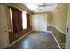 Bedroom with tile floors, trim, natural light, door to outside and closet with folding doors at 1174 Orchard Dr, Fort Mill, SC 29715