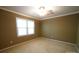 Bedroom filled with natural light has neutral walls, plush carpeting, and a modern ceiling fan at 1174 Orchard Dr, Fort Mill, SC 29715