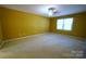 Spacious bedroom with carpet, ceiling fan and natural light from the window at 1174 Orchard Dr, Fort Mill, SC 29715