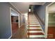 Hallway with staircase and entrances to living room and other rooms in the home at 1174 Orchard Dr, Fort Mill, SC 29715