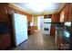 Traditional kitchen with granite counters, cabinets, tile backsplash, white appliances and tile flooring at 1174 Orchard Dr, Fort Mill, SC 29715