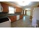Traditional style kitchen with granite counters, tiled backsplash, tile floors, cabinets and white appliances at 1174 Orchard Dr, Fort Mill, SC 29715
